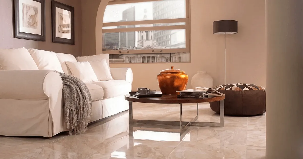 Modern living room with professionally installed marble flooring, a beige sofa, coffee table in Providence, RI