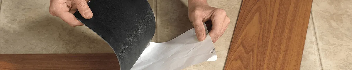 A professional installing vinyl flooring in Providence, RI
